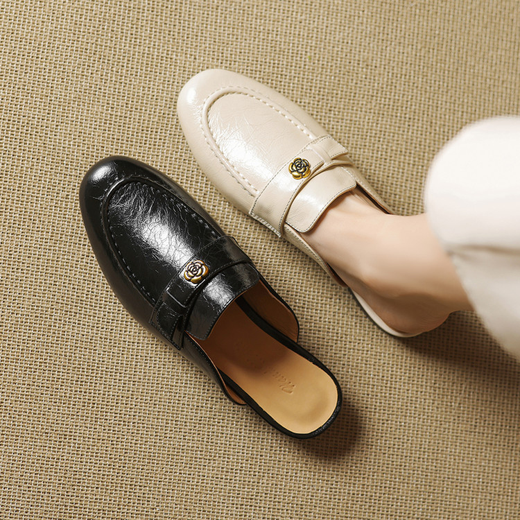 minimalist-leather-closed-toe-slippers-with-buckle-and-metal-accents Minimalist Leather Closed-Toe Slippers with Buckle and Metal Accents